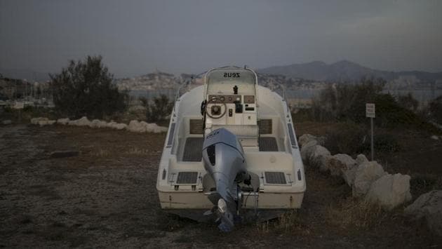 A boat sits atop a hill on the Frioul Archipelago during France’s confinement measures meant to stop the spread of the new coronavirus. (Daniel Cole / AP) A boat sits atop a hill on the Frioul Archipelago during France’s confinement measures meant to stop the spread of the new coronavirus. (Daniel Cole / AP)