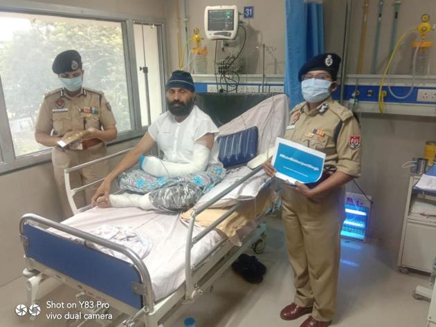As top policemen and others in khaki replaced their name badges with his, sub-inspector HarjeetSingh said it was not just pride but “an emotional moment for him. (HT PHOTO) As top policemen and others in khaki replaced their name badges with his, sub-inspector HarjeetSingh said it was not just pride but “an emotional moment for him. (HT PHOTO)