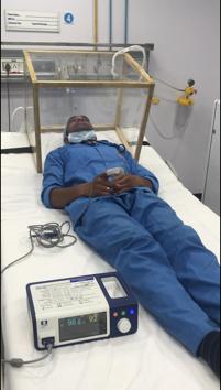 A volunteer lying inside the containment box designed by IIT Ropar and Dayanand Medical College and Hospital, Ludhiana, to test for patient comfort and aerosol containment capability. (Bahadurjeet Singh/HT) A volunteer lying inside the containment box designed by IIT Ropar and Dayanand Medical College and Hospital, Ludhiana, to test for patient comfort and aerosol containment capability. (Bahadurjeet Singh/HT)