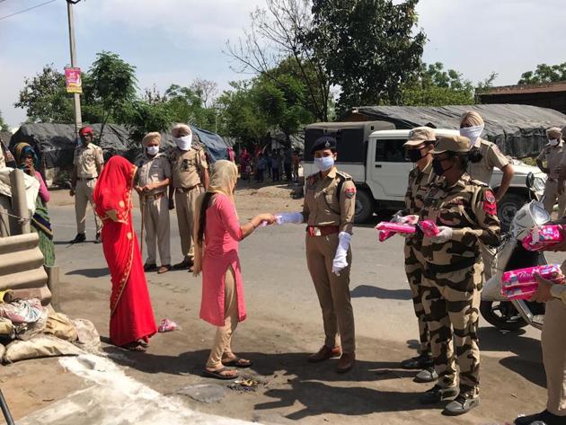 Initially hesitant, women later came forward to take the pads handed out by Punjab Police personnel and volunteers of an NGO, on Monday in Mohali.