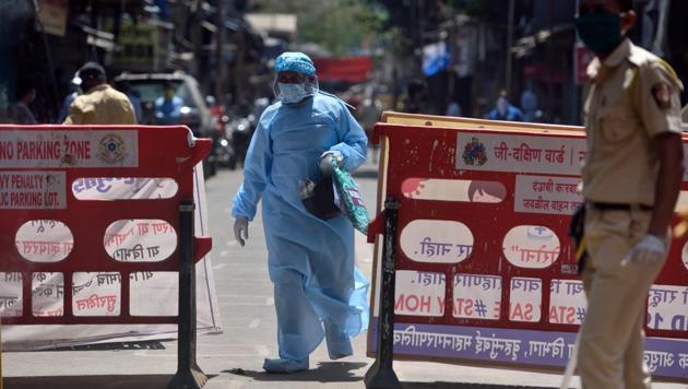 A medical officer coming out from Jijamata Nagar, Worli, during the nationwide lockdow, imposed in the walk of the coronavirus pandemic in Mumbai, India, on Sunday, April 26, 2020. (Satish Bate/HT Photo) A medical officer coming out from Jijamata Nagar, Worli, during the nationwide lockdow, imposed in the walk of the coronavirus pandemic in Mumbai, India, on Sunday, April 26, 2020. (Satish Bate/HT Photo)