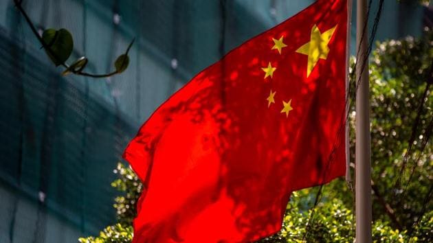 The Chinese flag flies outside the Liaison Office of the Central People's Government in the Sai Ying Pun district of Hong Kong, China.(Bloomberg) The Chinese flag flies outside the Liaison Office of the Central People's Government in the Sai Ying Pun district of Hong Kong, China.(Bloomberg)