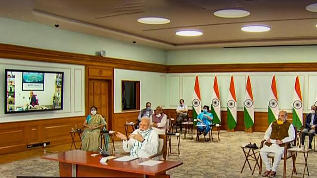 Prime Minister Narendra Modi, accompanied by Home Minister Amit Shah, Health Minister Harsh Vardhan and other officials, interacts with chief ministers of various states via video conferencing to discuss the Covid-19 situation, in New Delhi on Monday.(PTI Photo)