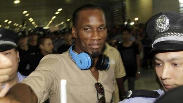 Former Chelsea star Didier-Drogba is escorted by police-officers upon his arrival at Pudong International Airport in Shanghai. (AP-Photo) Former Chelsea star Didier-Drogba is escorted by police-officers upon his arrival at Pudong International Airport in Shanghai. (AP-Photo)