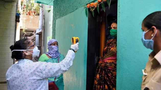 A medical worker conducts door-to-door thermal screening of residents in Dharavi’s Koliwada. Officials of the Brihanmumbai Municipal Corporation (BMC) have said they are preparing for a spike by May 15. Manisha Mhaiskar, one of the bureaucrats on its Covid-19 task-force, says the BMC is basing preparations on the projections of the central team, which recently visited the state. (Satish Bate / HT Photo) A medical worker conducts door-to-door thermal screening of residents in Dharavi’s Koliwada. Officials of the Brihanmumbai Municipal Corporation (BMC) have said they are preparing for a spike by May 15. Manisha Mhaiskar, one of the bureaucrats on its Covid-19 task-force, says the BMC is basing preparations on the projections of the central team, which recently visited the state. (Satish Bate / HT Photo)