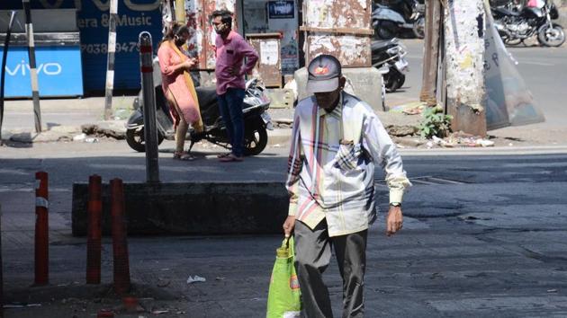 A senior citizen ventured out of home to purchase essential things in Pune. Authorities say mainly senior citizens and people will comorbid conditions like diabetics, blood pressure, heart and kidney-related ailments are vulnerable to coronavirus. (RAVINDRA JOSHI) A senior citizen ventured out of home to purchase essential things in Pune. Authorities say mainly senior citizens and people will comorbid conditions like diabetics, blood pressure, heart and kidney-related ailments are vulnerable to coronavirus. (RAVINDRA JOSHI)