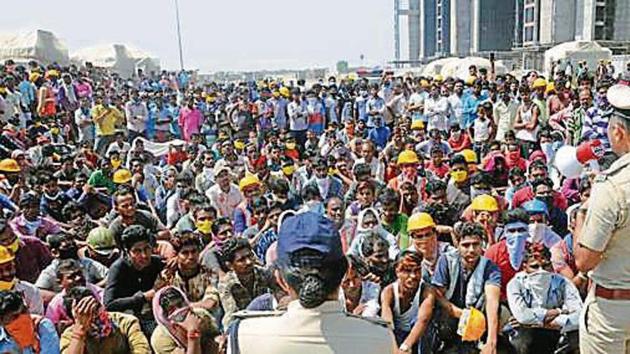 Police officials appeal to protesting migrant workers to maintain calm at Diamond Bourse construction site, in Surat on Tuesday. (PTI) Police officials appeal to protesting migrant workers to maintain calm at Diamond Bourse construction site, in Surat on Tuesday. (PTI)