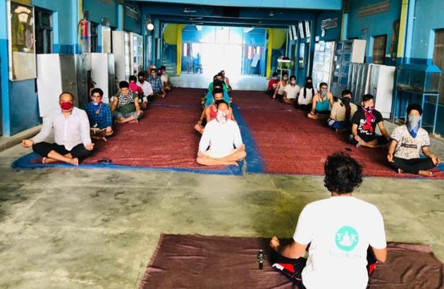 Yogacharya Rajhans Mishra imparting yoga and meditation to Nepal citizens at a quarantine center in Dhaurahra tehsil on Tuesday. Yogacharya Rajhans Mishra imparting yoga and meditation to Nepal citizens at a quarantine center in Dhaurahra tehsil on Tuesday.