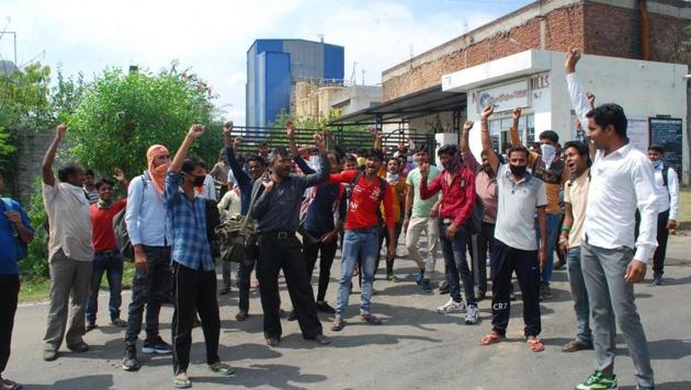 Employees protesting outside the mill in Kathua district on Tuesday. (HT Photo) Employees protesting outside the mill in Kathua district on Tuesday. (HT Photo)