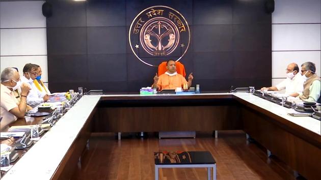 Uttar Pradesh Chief Minister Yogi Adityanath chairs a meeting with 'Covid-19 management Team-11' of the state in Lucknow on Tuesday. (ANI Photo) Uttar Pradesh Chief Minister Yogi Adityanath chairs a meeting with 'Covid-19 management Team-11' of the state in Lucknow on Tuesday. (ANI Photo)