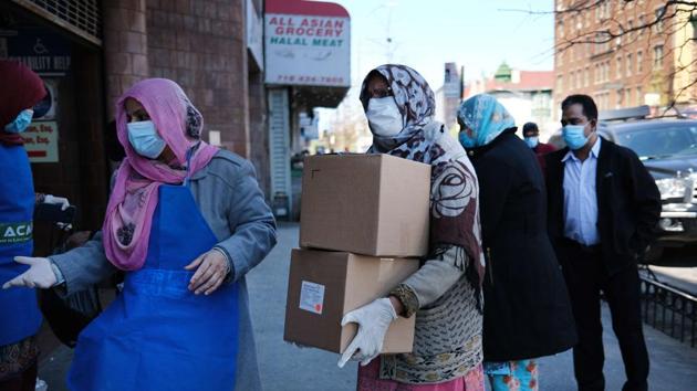Halal food boxes are distributed to those in need during Ramzan on April 28, 2020 in the Brooklyn borough of New York City amid the coronavirus pandemic. Covid-19 deaths in the United States neared 59,000 as on April 28, 2020. (AFP) Halal food boxes are distributed to those in need during Ramzan on April 28, 2020 in the Brooklyn borough of New York City amid the coronavirus pandemic. Covid-19 deaths in the United States neared 59,000 as on April 28, 2020. (AFP)