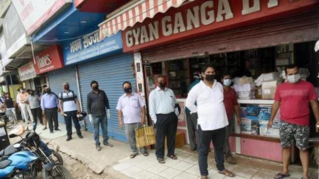 People are standing in queue for syllabus book for their children at Gyan Ganga book store, Boring road in Patna during nationwide lockdown in the wake of the Coronavirus Pandemic. (Santosh Kumar/ HT) People are standing in queue for syllabus book for their children at Gyan Ganga book store, Boring road in Patna during nationwide lockdown in the wake of the Coronavirus Pandemic. (Santosh Kumar/ HT)