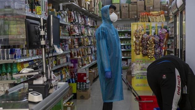A man wearing a face mask buys items in a supermarket in Madrid, Spain. (AP photo) A man wearing a face mask buys items in a supermarket in Madrid, Spain. (AP photo)