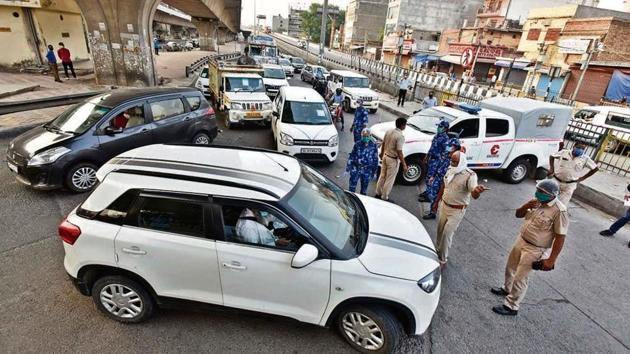 Haryana Police personnel intercept incoming vehicles at the Delhi-Faridabad border on NH-19. Haryana Police personnel intercept incoming vehicles at the Delhi-Faridabad border on NH-19.