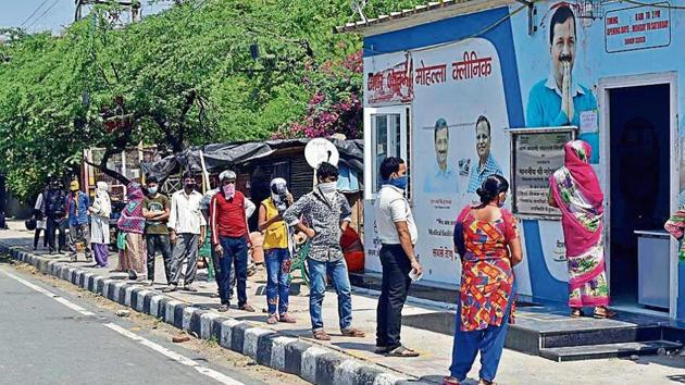 People queue outside a mohalla clinic in Vasant Kunj. Small hospitals, dispensaries and mohalla clinics are providing health care to patients with health problems other than Covid-19.