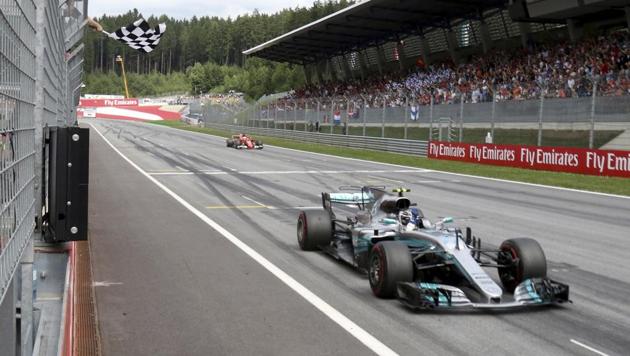 Mercedes driver Valtteri Bottas of Finland crosses the finish line to win the Austrian Formula One Grand Prix at the Red Bull Ring racetrack southern Austria, Sunday, July 9, 2017.(AP)