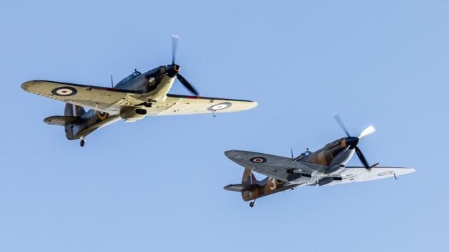 Squadron Leader Mark "Disco" Discombe flies in the Hurricane and Flight Lieutenant Andy Preece flies in a Spitfire over the house of former British Army Officer Captain Tom Moore, as a part of celebration of his 100th birthday and a gesture of appreciation for his fundraising achievements for the NHS, in Bedfordshire, Britain, April 30. (UK Ministry of Defence / Crown Copyright 2020 via REUTERS) Squadron Leader Mark "Disco" Discombe flies in the Hurricane and Flight Lieutenant Andy Preece flies in a Spitfire over the house of former British Army Officer Captain Tom Moore, as a part of celebration of his 100th birthday and a gesture of appreciation for his fundraising achievements for the NHS, in Bedfordshire, Britain, April 30. (UK Ministry of Defence / Crown Copyright 2020 via REUTERS)