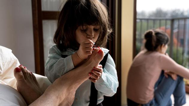 Schoolteacher Marzio Toniolo, 35, takes a picture of his daughter Bianca painting his toenails as his wife and Bianca's mother Chiara Zuddas looks out from their balcony. The 35-year-old elementary school teacher, his wife, and their daughter, are staying in his grandparents’ house in San Fiorano, a small town in northern Italy. (Marzio Toniolo via REUTERS) Schoolteacher Marzio Toniolo, 35, takes a picture of his daughter Bianca painting his toenails as his wife and Bianca's mother Chiara Zuddas looks out from their balcony. The 35-year-old elementary school teacher, his wife, and their daughter, are staying in his grandparents’ house in San Fiorano, a small town in northern Italy. (Marzio Toniolo via REUTERS)