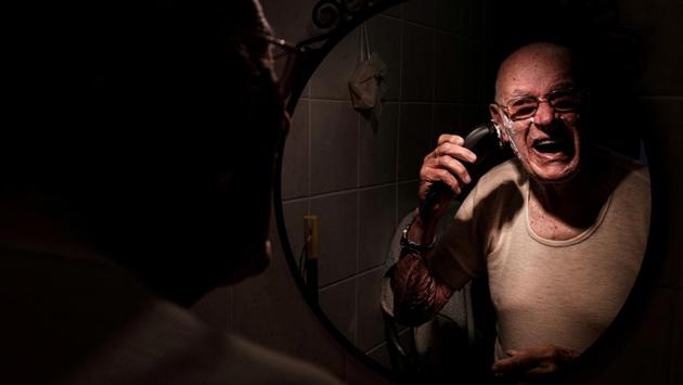 Gino Verani shaves his beard at home in San Fiorano. After about a month, Toniolo’s father returned home to Sardinia. Things began settling down. But the real concern was Gino, who suffers from short-term memory loss. (Marzio Toniolo via REUTERS) Gino Verani shaves his beard at home in San Fiorano. After about a month, Toniolo’s father returned home to Sardinia. Things began settling down. But the real concern was Gino, who suffers from short-term memory loss. (Marzio Toniolo via REUTERS)