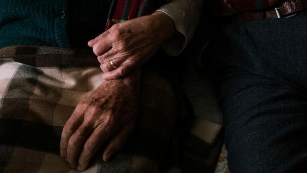 Gino Verani and his wife Ines Prandini link arms at home. “At the start, we were really afraid and did not let him go out. My grandmother used to go to church but when my grandfather started getting worse, she stopped,” Toniolo said. Gino would go to bed early and wake up at 10 p.m. convinced it was breakfast time. (Marzio Toniolo via REUTERS) Gino Verani and his wife Ines Prandini link arms at home. “At the start, we were really afraid and did not let him go out. My grandmother used to go to church but when my grandfather started getting worse, she stopped,” Toniolo said. Gino would go to bed early and wake up at 10 p.m. convinced it was breakfast time. (Marzio Toniolo via REUTERS)