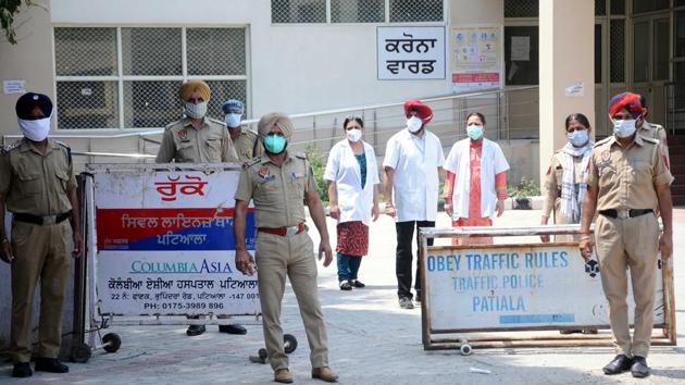 Police personnel and doctors seen outside the coronavirus ward, during Covid-19 lockdown at Rajindra Hospital in Patiala on Wednesday. (Bharat Bhushan?HT Photo) Police personnel and doctors seen outside the coronavirus ward, during Covid-19 lockdown at Rajindra Hospital in Patiala on Wednesday. (Bharat Bhushan?HT Photo)
