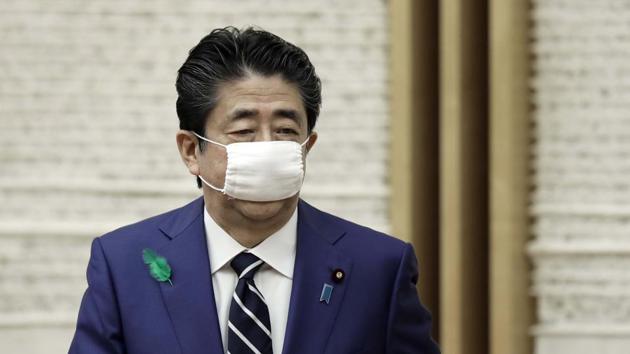 Japanese Prime Minister Shinzo Abe wearing a protective mask as a precautionary measure amid Covid-19 outbreak.(AP)