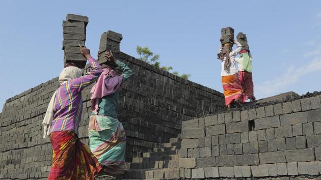 Indian women carry bricks as they work at a brick kiln on the outskirts of Hyderabad. (AP) Indian women carry bricks as they work at a brick kiln on the outskirts of Hyderabad. (AP)