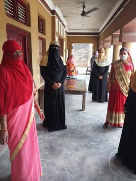 Women waiting for rations following social distancing in a Barabanki village in Uttar Pradesh.(HT Photo)