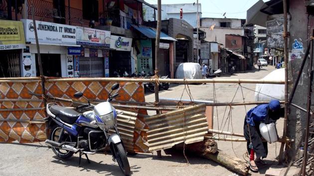 A Dharavi resident bypasses a barricade in Mumbai. (ANI Photo) A Dharavi resident bypasses a barricade in Mumbai. (ANI Photo)