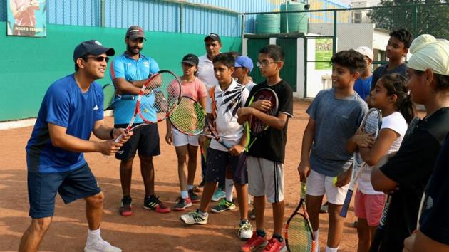 Coach Gaurav Chadha and former Davis cupper Harsh Mankad during a tennis camp at Roots Tennis Academy in Zirakpur. Chadha runs three centres in the tricity and is facing financial heat due to the lockdown.(HT File Photo)