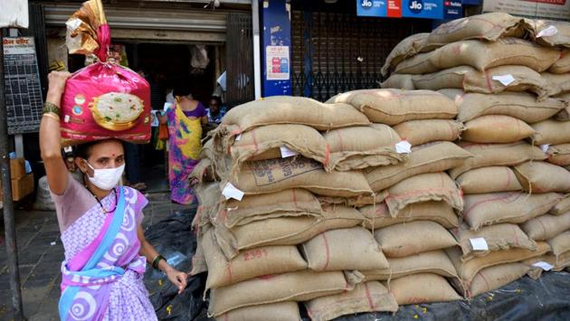 A woman takes back food items provided by the government in Mumbai’s Worli on April 26. (Satish Bate / HT Photo) A woman takes back food items provided by the government in Mumbai’s Worli on April 26. (Satish Bate / HT Photo)