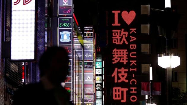 A passerby is seen in Kabukicho nightlife district, during a state of emergency to fight the coronavirus disease (COVID-19) outbreak, in Tokyo. (REUTERS) A passerby is seen in Kabukicho nightlife district, during a state of emergency to fight the coronavirus disease (COVID-19) outbreak, in Tokyo. (REUTERS)