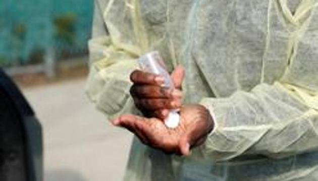 As per the report prepared by the department, hand sanitiser was filled in the bottles from the buckets and drums with taps. (REUTERS) As per the report prepared by the department, hand sanitiser was filled in the bottles from the buckets and drums with taps. (REUTERS)