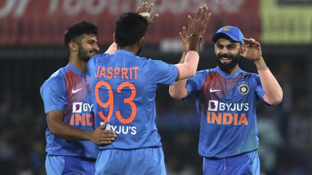 India's captain Virat Kohli, right, celebrates the dismissal of Sri Lanka's Dasun Shanaka by teammate Jasprit Bumrah, center, during the second Twenty20 international cricket match between India and Sri Lanka in Indore, India, Tuesday, Jan. 7, 2020. (AP Photo/Aijaz Rahi) (AP) India's captain Virat Kohli, right, celebrates the dismissal of Sri Lanka's Dasun Shanaka by teammate Jasprit Bumrah, center, during the second Twenty20 international cricket match between India and Sri Lanka in Indore, India, Tuesday, Jan. 7, 2020. (AP Photo/Aijaz Rahi) (AP)