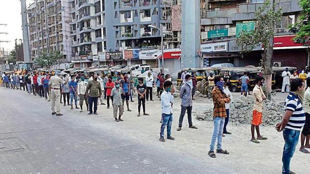 Migrant workers gather in huge numbers at Laljipada, Kandivali in Mumbai, on Friday, looking for a way to return to their villages in Uttar Pradesh.