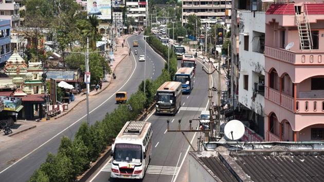 Buses carrying migrant workers, belonging to Srikakulam and Vizianagaram, who were stranded in Gujarat in the wake of the lockdown, seen passing through Vijayawada, on May 1. The movement of migrant workers, pilgrims, students, tourists and other stranded people has been allowed by state buses. New guidelines now include the use of trains. (PTI)