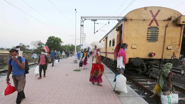 Migrant workers arrive at the Misrod railway station by a special train from Nashik, during the ongoing COVID-19 lockdown in Bhopal, Saturday, May 02. This is the first special train that has reached Bhopal after the Centre's announcement to run such services for the workers. (PTI)