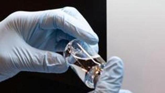 A lab technician visually inspects a filled vial of investigational coronavirus disease (COVID-19) treatment drug remdesivir at a Gilead Sciences facility in La Verne, California(via REUTERS) A lab technician visually inspects a filled vial of investigational coronavirus disease (COVID-19) treatment drug remdesivir at a Gilead Sciences facility in La Verne, California(via REUTERS)
