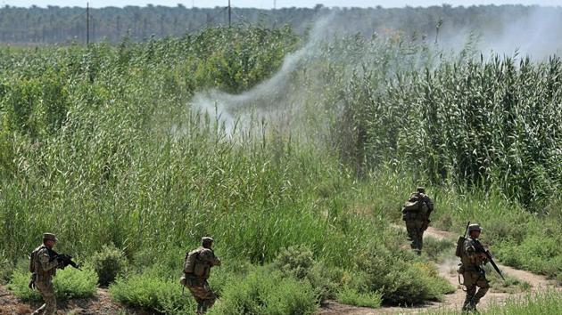 Security forces detonate an explosive device placed by the Islamic State militants during a search operation in Taramiyah, 50 kilometers (31 miles) north of Baghdad, Iraq. (AP) Security forces detonate an explosive device placed by the Islamic State militants during a search operation in Taramiyah, 50 kilometers (31 miles) north of Baghdad, Iraq. (AP)