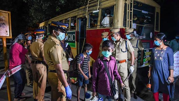 Migrants being screened as they arrive at Aluva Station to board a special train for Bhubaneswar to reach their native places, amid ongoing COVID-19 lockdown in Kochi, Friday, May 1. (PTI)