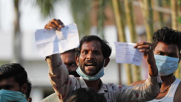 A worker displays his identification as he protests against poor treatment at the quarantine center he has been kept in, along with others who arrived from outside the state. (AP/ File photo) A worker displays his identification as he protests against poor treatment at the quarantine center he has been kept in, along with others who arrived from outside the state. (AP/ File photo)