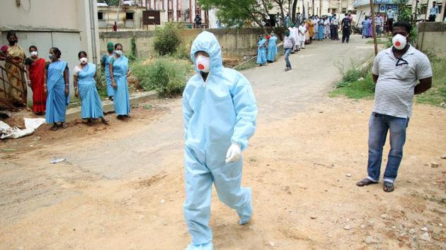 A man wearing protective gear as he walks towards Ambulance during the nationwide lockdown to slow down the spreading of coronavirus disease (COVID-19), at a Hospital in Agartala on Saturday. (ANI) A man wearing protective gear as he walks towards Ambulance during the nationwide lockdown to slow down the spreading of coronavirus disease (COVID-19), at a Hospital in Agartala on Saturday. (ANI)