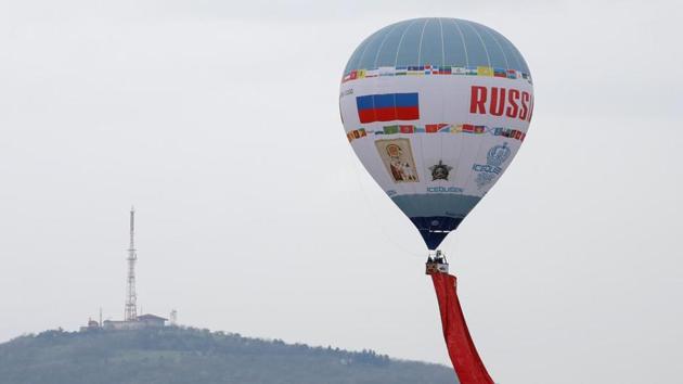 Authorities are preparing to set up temporary field hospitals around Moscow in case infections continue to surge. Here, a hot air balloon raises the Banner of Victory into the air to mark the 75th anniversary of the conquest of Berlin. (REUTERS) Authorities are preparing to set up temporary field hospitals around Moscow in case infections continue to surge. Here, a hot air balloon raises the Banner of Victory into the air to mark the 75th anniversary of the conquest of Berlin. (REUTERS)