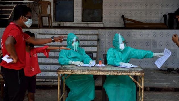 Doctors conducting Covid-19 test at Dadar, Mumbai, during the nationwide lockdown. (Satish Bate/HT File) Doctors conducting Covid-19 test at Dadar, Mumbai, during the nationwide lockdown. (Satish Bate/HT File)