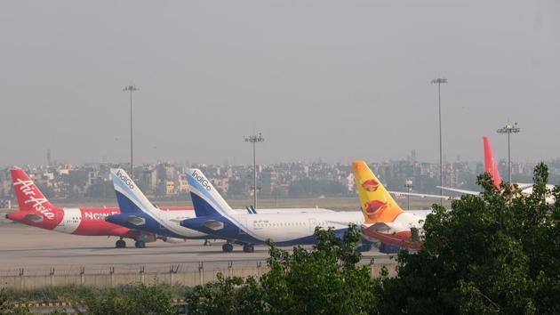 Grounded aircraft stand at Terminal 3 at the Indira Gandhi International Airport during a lockdown implemented due to the coronavirus in New Delhi. (Bloomberg) Grounded aircraft stand at Terminal 3 at the Indira Gandhi International Airport during a lockdown implemented due to the coronavirus in New Delhi. (Bloomberg)