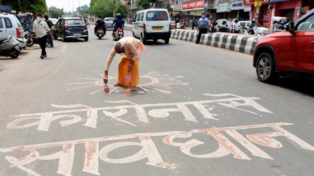 An artist draws a graffiti to spread awareness about coronavirus in New Delhi on Monday. (ANI photo) An artist draws a graffiti to spread awareness about coronavirus in New Delhi on Monday. (ANI photo)