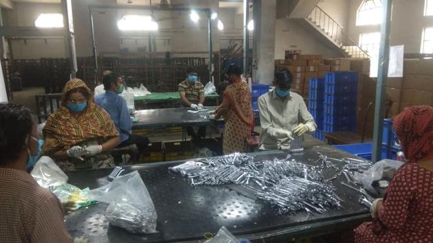Workers seen at a hand tools manufacturing unit in Jalandhar, Punjab. Restrictions were eased for industrial work, while maintaining norms for proper social distancing. (Pradeep Pandit / HT Photo)