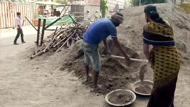 Construction activities resume where workers reside on site of construction, following revised guidelines issued by the Ministry of Home Affairs, amid the extended lockdown, in New Delhi. (ANI)