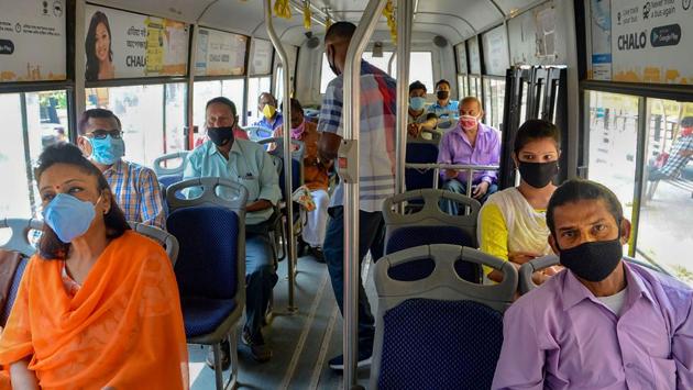 Commuters wearing facemasks seen inside a bus in Guwahati, Assam. Areas under green zones, or places that have not seen any incidence of Covid-19 infection in 21 days, are allowed to resume all activities except those prohibited nationally.Buses are allowed to operate at 50 per cent capacity, reported HT. (PTI)