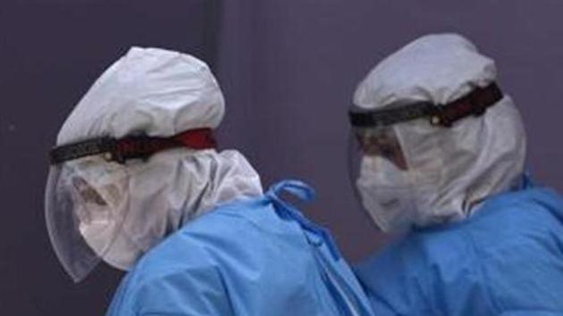 The doctors deployed on coronavirus duty at the civil hospital have also complained that wearing PPE kits amid the rising temperatures takes a toll on their health. (HT Photo) The doctors deployed on coronavirus duty at the civil hospital have also complained that wearing PPE kits amid the rising temperatures takes a toll on their health. (HT Photo)